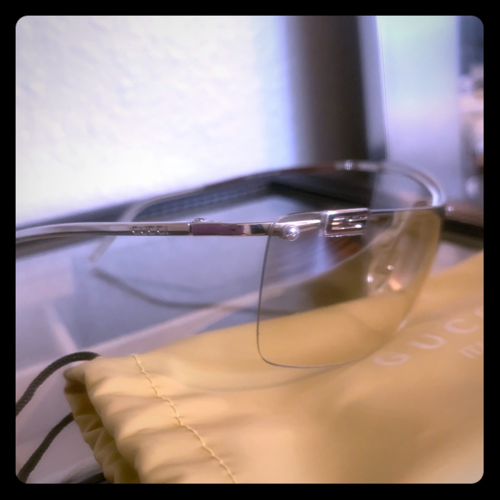 Gucci light tinted silver frame gradient blades.